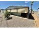 Mobile home with covered patio and landscaping at 305 S Val Vista Dr # 37, Mesa, AZ 85204