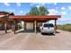 Covered carport with space for two vehicles and off-road toys at 1310 Kenrick Dr, Wickenburg, AZ 85390