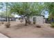 Brick house with green trim and desert landscaping at 1818 W Thomas Rd, Phoenix, AZ 85015