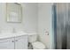 Bathroom with white vanity, toilet, and shower/tub combo at 1818 W Thomas Rd, Phoenix, AZ 85015