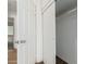 Bright white closet with sliding doors and wood flooring at 1818 W Thomas Rd, Phoenix, AZ 85015