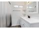 Clean bathroom with vanity, mirror, and shower at 1818 W Thomas Rd, Phoenix, AZ 85015