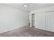 Bedroom with ceiling fan, carpet, and double door closet at 1818 W Thomas Rd, Phoenix, AZ 85015