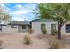 Brick house with green trim and desert landscaping at 1818 W Thomas Rd, Phoenix, AZ 85015
