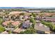 Aerial view showing residential homes and a nearby commercial area, in a sunny setting at 1356 E 9Th Pl, Casa Grande, AZ 85122