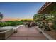 Infinity pool with lounge chairs and sunset views at 41504 N 107Th Way, Scottsdale, AZ 85262