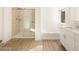 Clean bathroom with shower, tub, and modern vanity at 20336 N 224Th Dr, Surprise, AZ 85387