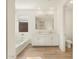 Elegant bathroom featuring double sinks and a large mirror at 20336 N 224Th Dr, Surprise, AZ 85387