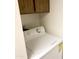 White washer and dryer in a small laundry room with cabinets at 4608 W Maryland Ave # 144, Glendale, AZ 85301