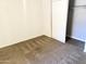 Bright bedroom with neutral carpeting and a large closet at 4608 W Maryland Ave # 144, Glendale, AZ 85301