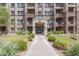 Exterior view of condo building with landscaping and walkway at 5350 E Deer Valley Dr # 4435, Phoenix, AZ 85054