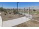 Concrete pathway with gate access to grassy area at 24248 W Bowker St, Buckeye, AZ 85326