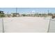 Community basketball court with playground in background at 24248 W Bowker St, Buckeye, AZ 85326