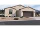 Single-story home with a two-car garage and desert landscaping at 24224 W Bowker St, Buckeye, AZ 85326