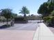 Gated community entrance with brick and landscaping at 9728 N 106Th Pl # 154, Scottsdale, AZ 85258