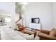 Spacious living room with hardwood floors, high ceilings and a view of the kitchen at 7761 N 19Th Ln, Phoenix, AZ 85021