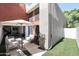 Private patio with seating area, umbrella, and artificial turf at 7761 N 19Th Ln, Phoenix, AZ 85021