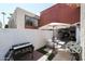 Private patio with Blackstone grill, seating, and artificial turf at 7761 N 19Th Ln, Phoenix, AZ 85021