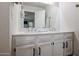 Clean bathroom with double vanity and white cabinets at 7761 N 19Th Ln, Phoenix, AZ 85021