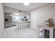 Updated kitchen with white cabinets and stainless steel appliances at 7761 N 19Th Ln, Phoenix, AZ 85021