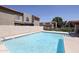 Inviting community pool with surrounding buildings at 7761 N 19Th Ln, Phoenix, AZ 85021