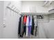 Well-organized closet with hanging clothes and storage at 7761 N 19Th Ln, Phoenix, AZ 85021