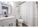 Clean bathroom with white vanity, black fixtures, and updated shower at 7761 N 19Th Ln, Phoenix, AZ 85021