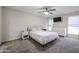 Bright bedroom with double bed, dresser, and carpet flooring at 7761 N 19Th Ln, Phoenix, AZ 85021