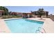 Community pool with pergola and lounge seating at 7761 N 19Th Ln, Phoenix, AZ 85021