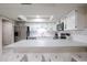 Eat-in kitchen with stainless steel appliances and a breakfast bar at 7761 N 19Th Ln, Phoenix, AZ 85021