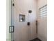 Modern shower with a glass enclosure and a built-in niche at 15864 N 115Th Way, Scottsdale, AZ 85255