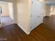 Light-toned hallway with wood-look flooring and access to other rooms at 18090 N Key Estrella Dr, Surprise, AZ 85374