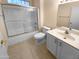 Clean bathroom with a shower/tub combo, vanity, and tile floor at 18090 N Key Estrella Dr, Surprise, AZ 85374