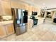 Modern kitchen with stainless steel appliances and light wood cabinets at 2610 E Nisbet Rd, Phoenix, AZ 85032