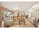 Bright living room with hardwood floors, comfortable seating, and large windows at 5302 E Mercer Ln, Scottsdale, AZ 85254