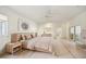 Large main bedroom with light wood floors and plenty of natural light at 5302 E Mercer Ln, Scottsdale, AZ 85254