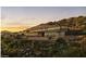 Modern house with infinity pool, nestled on a hillside with desert landscape at 5850 E Glen Dr, Paradise Valley, AZ 85253