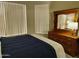 Spacious bedroom with dresser, mirror, and window coverings at 14950 W Mountain View Blvd # 1111, Surprise, AZ 85374