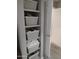 Well-organized closet with shelves and storage baskets at 14950 W Mountain View Blvd # 1111, Surprise, AZ 85374