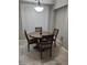 Round dining table with four chairs in a bright room at 14950 W Mountain View Blvd # 1111, Surprise, AZ 85374