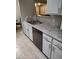 Kitchen with granite countertops and white cabinets at 14950 W Mountain View Blvd # 1111, Surprise, AZ 85374