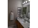 Bathroom with vanity, sink, medicine cabinet, and mirror at 14950 W Mountain View Blvd # 1111, Surprise, AZ 85374