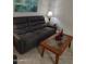 Relaxing living room with a reclining sofa and coffee table at 14950 W Mountain View Blvd # 1111, Surprise, AZ 85374
