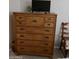 Bedroom with dresser, TV, and chair at 14950 W Mountain View Blvd # 1111, Surprise, AZ 85374