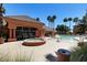 Community pool with surrounding landscaping and seating at 14950 W Mountain View Blvd # 1111, Surprise, AZ 85374