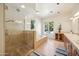 Elegant bathroom with a walk-in shower, soaking tub, and dual vanities at 5302 E Mercer Ln, Scottsdale, AZ 85254