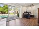 Home office with dual monitors and sliding glass doors overlooking the pool at 5302 E Mercer Ln, Scottsdale, AZ 85254