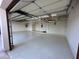 Garage with overhead storage and epoxy floor at 5302 E Mercer Ln, Scottsdale, AZ 85254