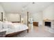 Bright and airy main bedroom with a fireplace and access to the backyard at 5302 E Mercer Ln, Scottsdale, AZ 85254
