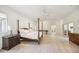 Spacious main bedroom with a four-poster bed and hardwood floors at 5302 E Mercer Ln, Scottsdale, AZ 85254